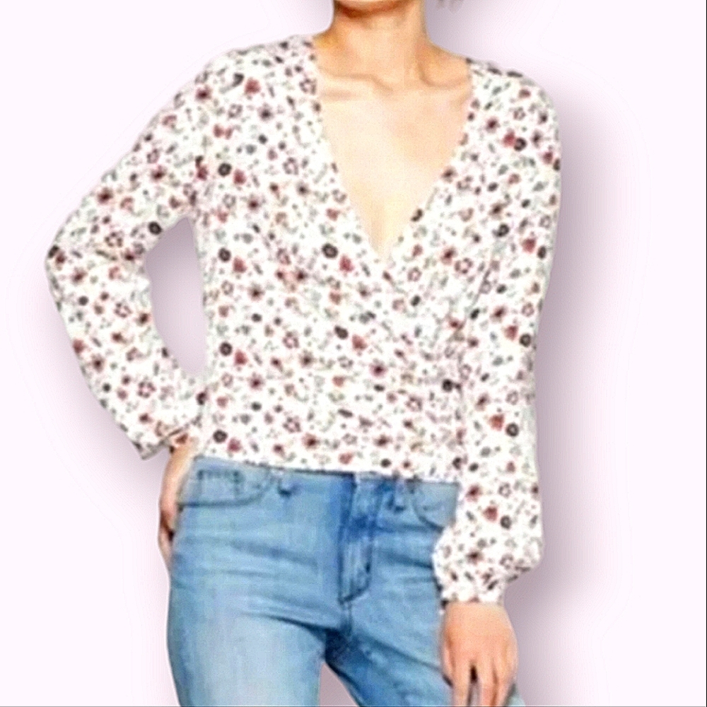 BY JUNKFOOD | Women's white and multi-color floral wrap top.